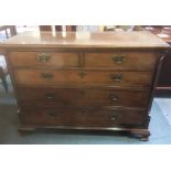 A MAHOGANY CHEST OF TWO SHORT AND THREE LONG DRAWERS with canted and fluted sides, on ogee moulded