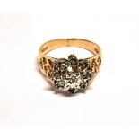 A 9CT GOLD AND SMALL DIAMOND FLOWER-HEAD CLUSTER RING the white gold head set with nine tiny eight-