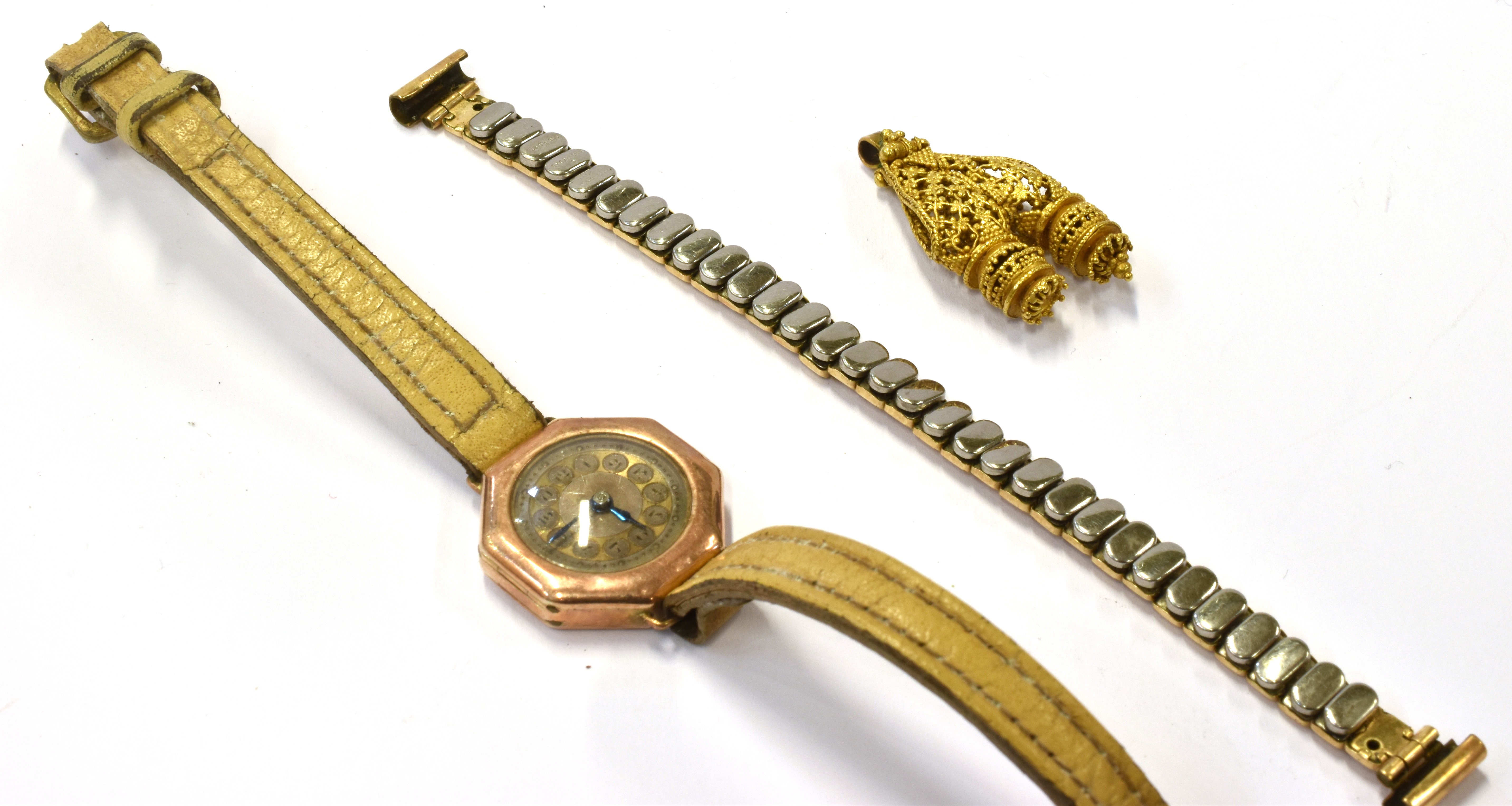 AN EARLY 20th CENTURY CONTINENTAL FILIGREE GOLD PENDANT AND A LADY'S 9CT GOLD WRISTWATCH, CIRCA 1923