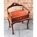 AN EDWARDIAN MAHOGANY PIANO STOOL on cabriole supports