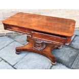 A 19TH CENTURY ROSEWOOD CENTRE TABLE with opposing drawer to each side, with acanthus and spiral