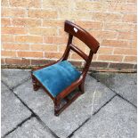 A VICTORIAN MAHOGANY CHILDS CHAIR with upholstered seat on turned supports with stretcher base