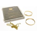 A MODERN CHILD'S 9CT GOLD EXPANDING BANGLE, ANOTHER AND A 9CT GOLD REPLICA QUEEN ANNE TOUCH PIECE