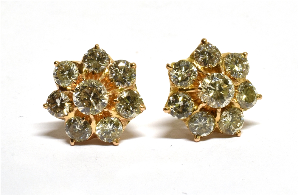 A PAIR OF DIAMOND FLOWER-HEAD CLUSTER STUD EARRINGS each claw set at the centre with a round - Image 4 of 4