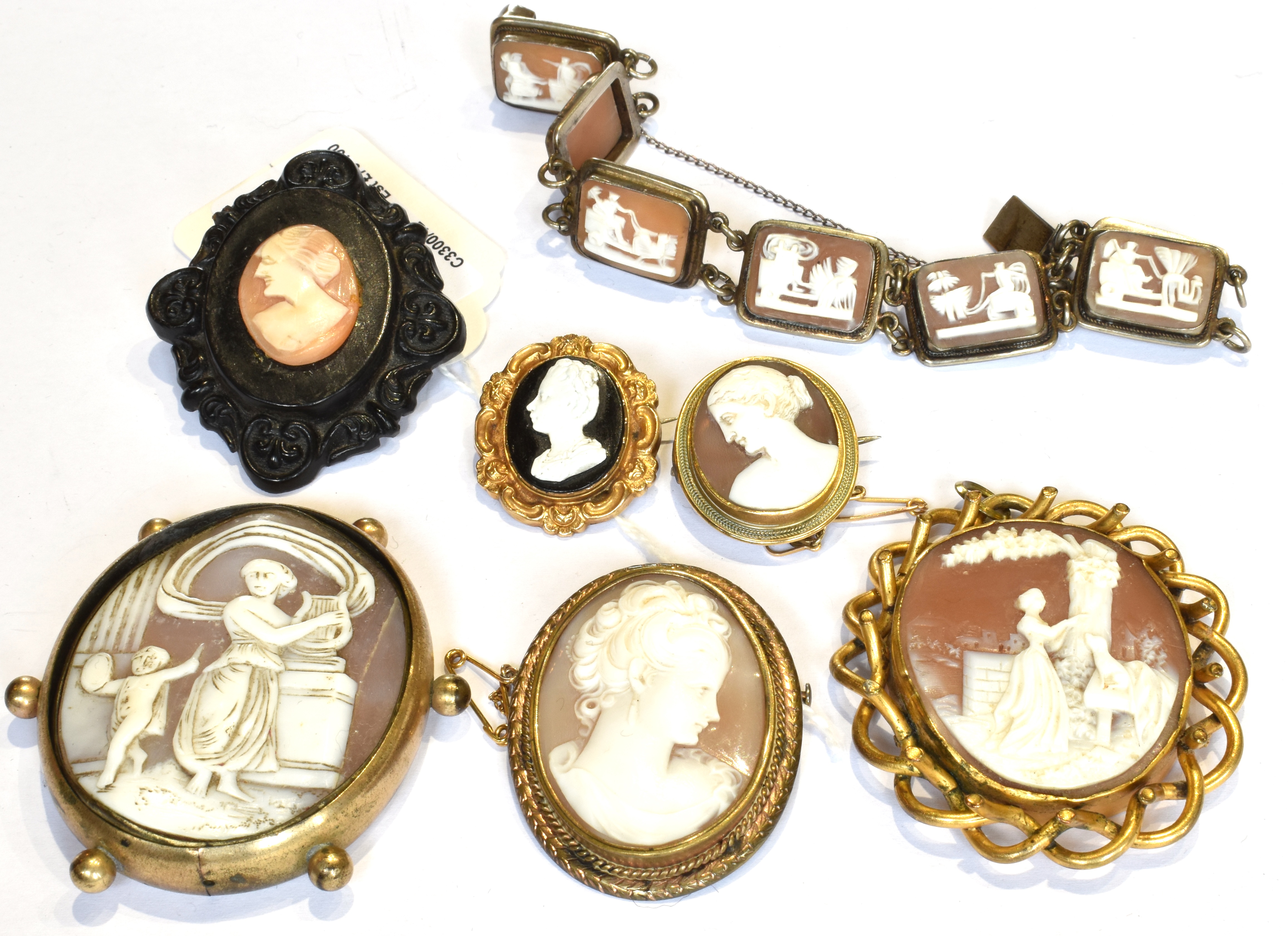 A COLLECTION OF VICTORIAN AND LATER SHELL CAMEO JEWELLERY INCLUDING A SIX PANEL BRACELET each