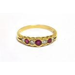 A MODERN 18CT GOLD, RUBY AND DIAMOND SEVEN STONE RING the four graduated round brilliant diamonds