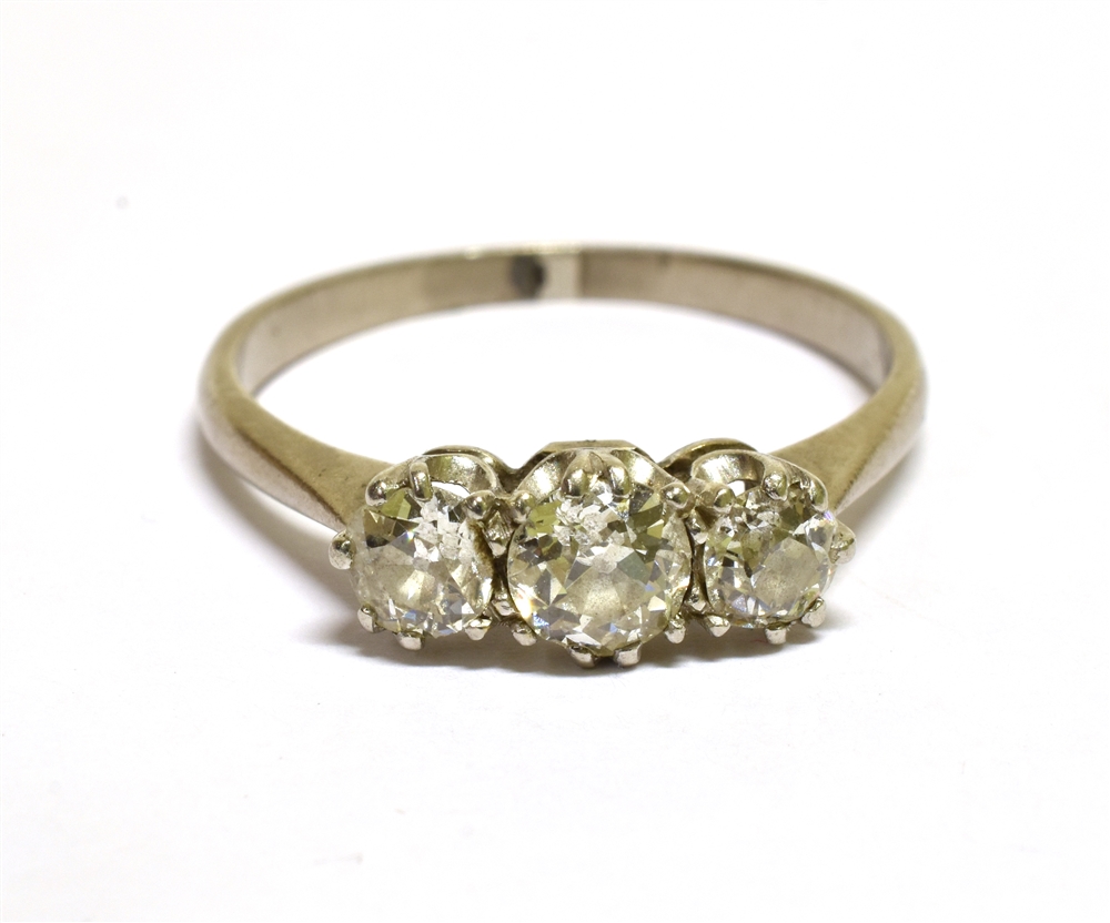 A MID-20TH CENTURY OLD-CUT DIAMOND THREE STONE RING the graduated old-cut stones approx. 0.72cts