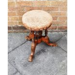 A VICTORIAN CARVED WALNUT REVOLVING PIANO STOOL