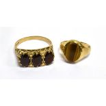 TWO 9CT GOLD AND GEM RINGS Comprising; an oval garnet three stone ring, London 1969, size R, 3.2g