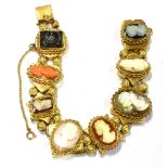 A MODERN CAMEO BRACELET in the form of eight panels of various shapes centrally set with a cameo