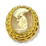 A VICTORIAN SHELL CAMEO OVAL BROOCH, DEPICTING ZEUS IN FORM OF AN EAGLE TAKING A LIBATION FROM