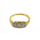 AN ART DECO DIAMOND THREE STONE RING the three round brilliants grain set within a white illusion