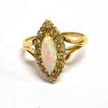 A LATE VICTORIAN GOLD, OPAL AND DIAMOND MARQUISE-SHAPED CLUSTER RING centred with a marquise-