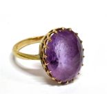 A VINTAGE GOLD AND OVAL AMETHYST SINGLE STONE RING the mixed-cut pale purple amethyst with a