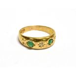 A LATE VICTORIAN 18CT GOLD, EMERALD AND DIAMOND THREE STONE GYPSY RING Centred with a small old-