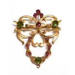 AN EARLY 20th CENTURY RUSSIAN GOLD AND GEM SET PENDENT BROOCH in the form of an open leaf and scroll