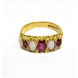 A VINTAGE 18CT GOLD, RUBY, OPAL AND DIAMOND CARVED HALF-HOOP RING IN VICTORIAN STYLE the three