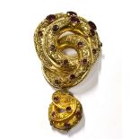 A MID VICTORIAN GOLD AND GARNET PENDENT BROOCH in the form of two graduated entwined domed