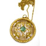 AN EDWARDIAN GOLD, PALE-GREEN TOURMALINE AND HALF-PEARL ROUND OPENWORK PENDANT ON A CHAIN the