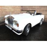A SHARNA TRI-ANG ROLLS-ROYCE CORNICHE ELECTRIC RIDE-IN CAR white, registration 'RRM 4', in very good
