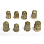 EIGHT ENGLISH SILVER THIMBLES late 19th and 20th century, each hallmarked, various makers, sizes and