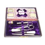 A LATE 19TH CENTURY UTILITARIAN CASED SEWING SET the maroon leather case lined with purple velvet