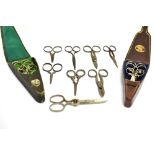 A LATE 19TH CENTURY LEATHER SCISSOR CASE by Taylor of Sheffield, containing a graduated set of three