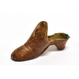 AN UNUSUAL EARLY 19TH CENTURY THIMBLE HOLDER in the form of a lady's heeled mule shoe, of brown