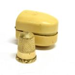 A LATE 19TH CENTURY GOLD THIMBLE size 7, with a punch decorated crown and sides, a wide vacant broad