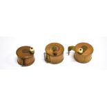 THREE 19TH CENTURY BOXWOOD 'FISHING REEL' TYPE TAPE MEASURES brass mounted, two with turned bone