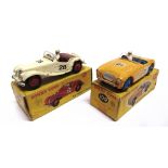 TWO DINKY MODEL RACING CARS comprising a No.108, M.G. Midget, cream with red ridged hubs, racing