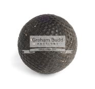 A "The Nottingham" black rubber core bramble pattern golf ball