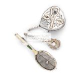 A Victorian fan shaped brooch in silver, with gold tennis racquet and horseshoe relief,