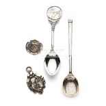 An unusual silver tennis racquet spoon, in the shape of the racquet,