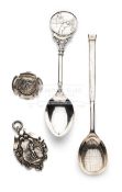 An unusual silver tennis racquet spoon, in the shape of the racquet,