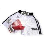 Tim Witherspoon signed boxing glove and trunks,