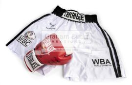 Tim Witherspoon signed boxing glove and trunks,