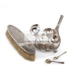 A silver-plated tennis racquet cruet stand,