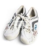 An autographed pair of FILA tennis shoes, signed by Kim Clijsters,