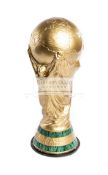 A full size replica of the FIFA World Cup trophy,