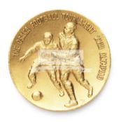 A gold medal awarded by the Japan Football Association for the 1964 Olympic Games Football