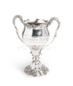 A Maurice McLoughlin Tennis Trophy,