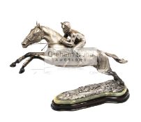 A large and impressive sterling silver sculpture of Desert Orchid with Simon Sherwood up,