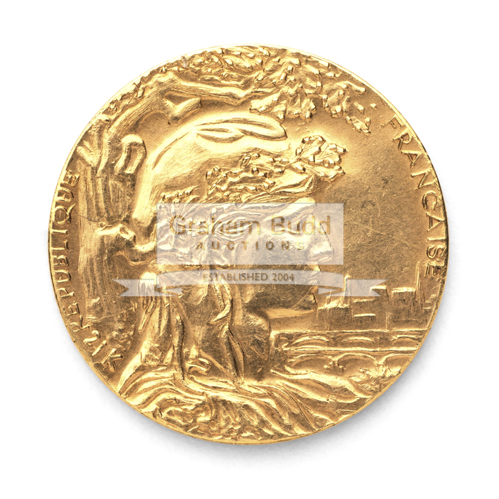 A 21k gold replica of the 1900 Paris Exposition Universelle Internationale medal designed by