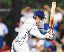 Fourteen signed photographs of England cricketers past and present,