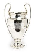 A UEFA Champions League Replica trophy the silver-plated twin handled baluster trophy cup with