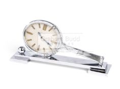 A chrome Tennis Racket 8 day Desk Clock,