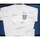 A white England retro shirt signed by seven former internationals, comprising Tom Finney,