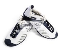 An autographed pair of Reebok DMX Flow-Pak tennis shoes, signed by Andy Roddic,