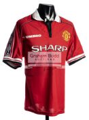 A Manchester United 1998-99 Treble Season replica jersey signed by the 'Holy Trinity' George Best,